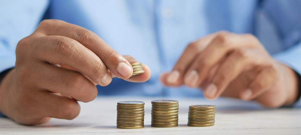 man holding coins