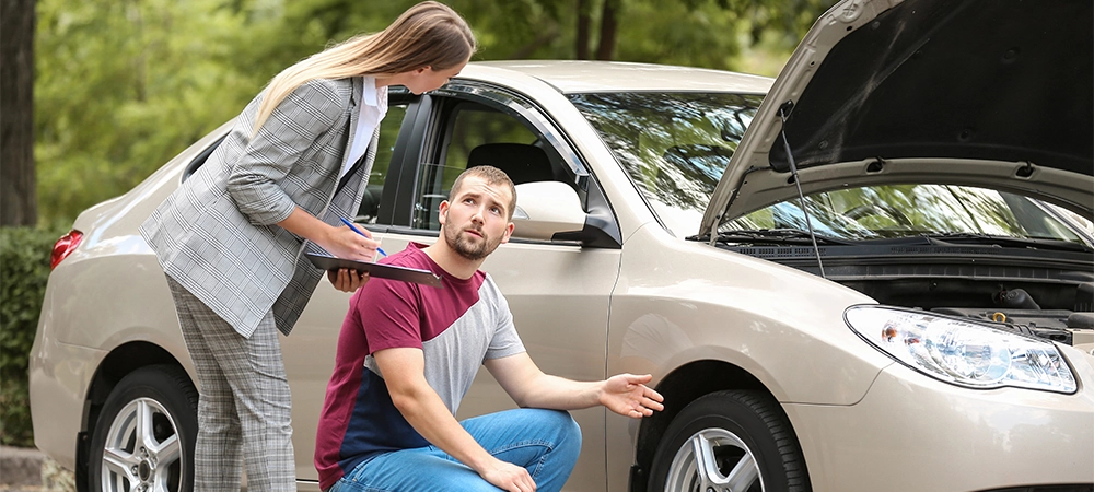 insurance agent checking man car