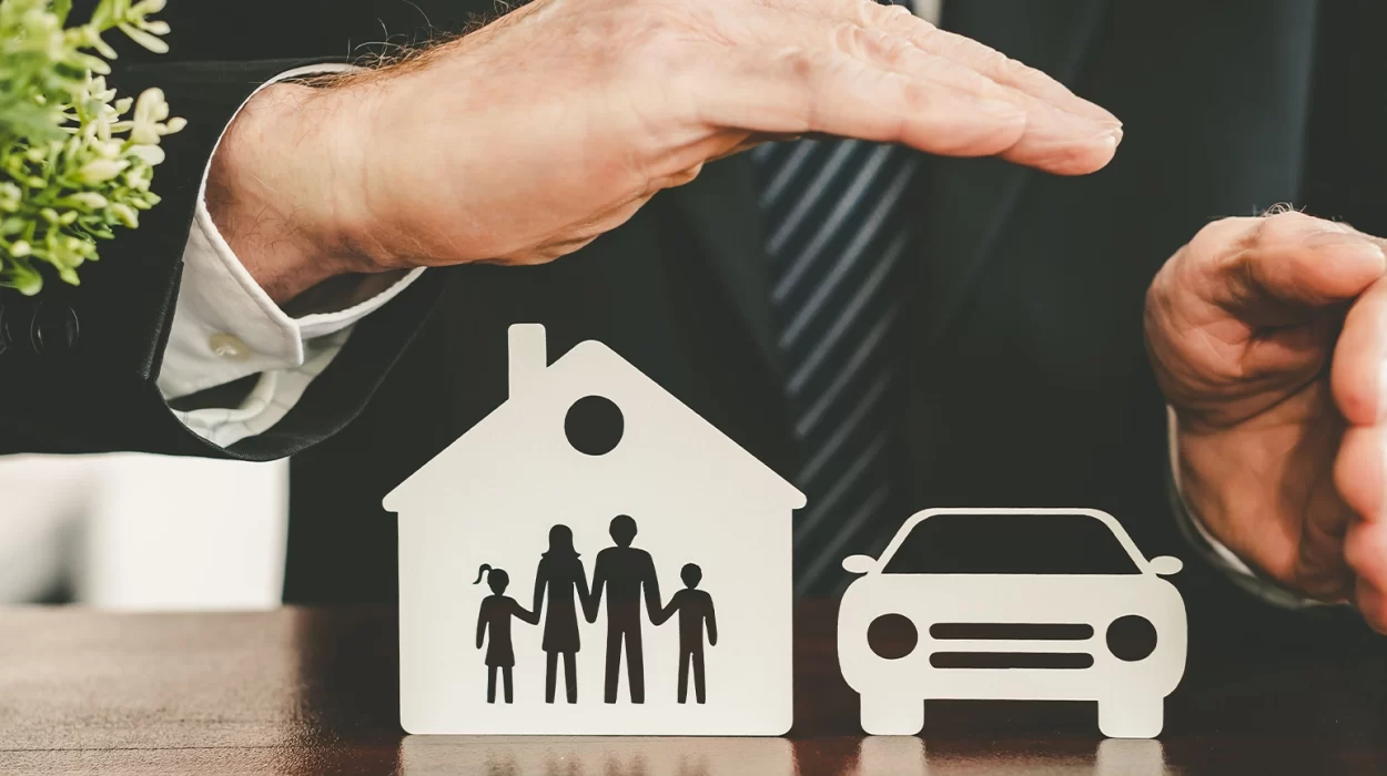 family, house and car protected by hands - concept of life, home and auto insurance
