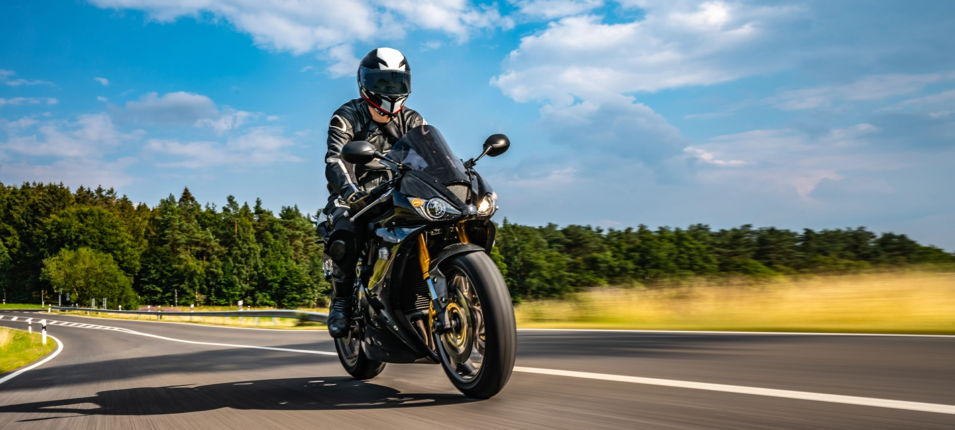 motorbike on the road riding. having fun driving the empty road on a motorcycle tour journey.