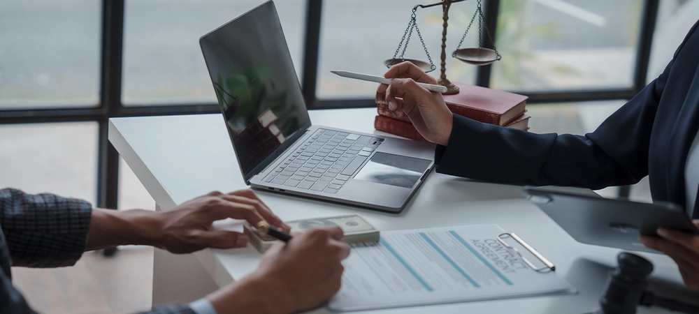 Lawsuits against Real estate agent and realtor general liability insurance businessman professional discussing and consultant with house toy model building before sign a contract with law concept