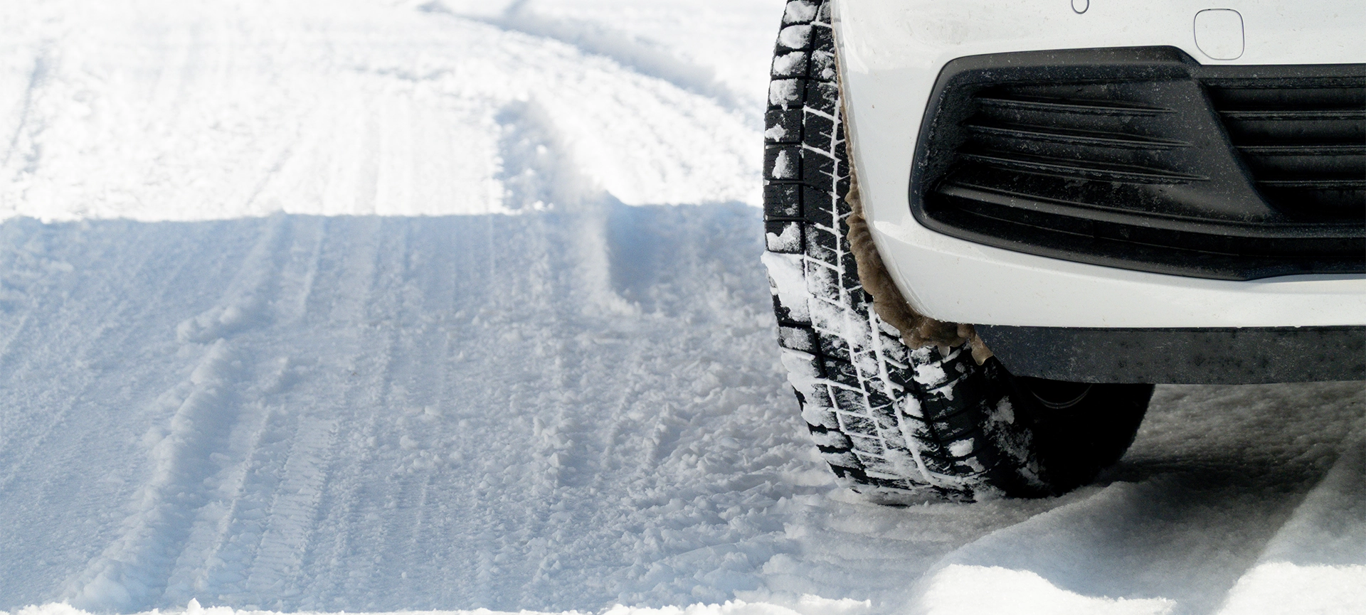 A car driving on a snow-covered road