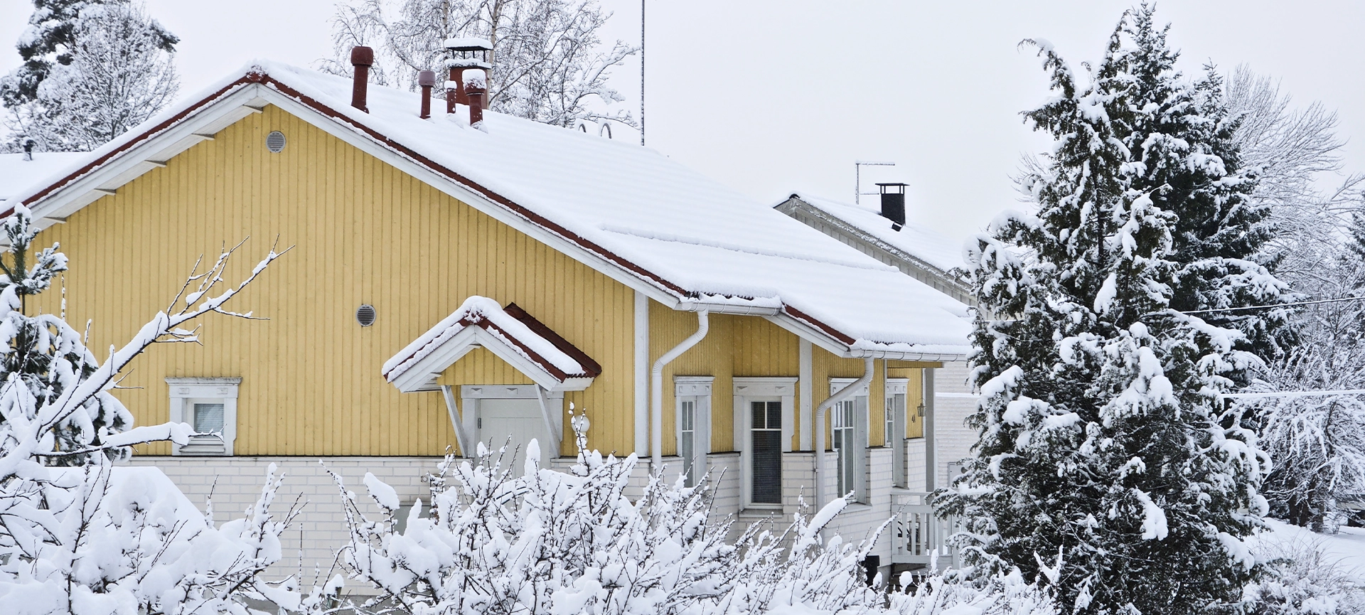 House roof covered with white snow