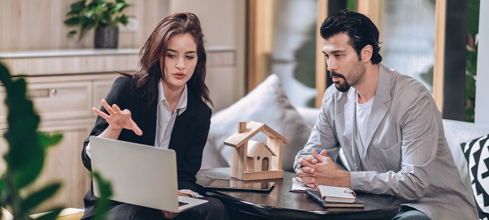 real estate sale agent discussion in office